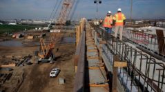 A construction crew works on an elevated section of track for the high-speed rail system in Fresno in February. Photo: Michael Macor, The Chronicle